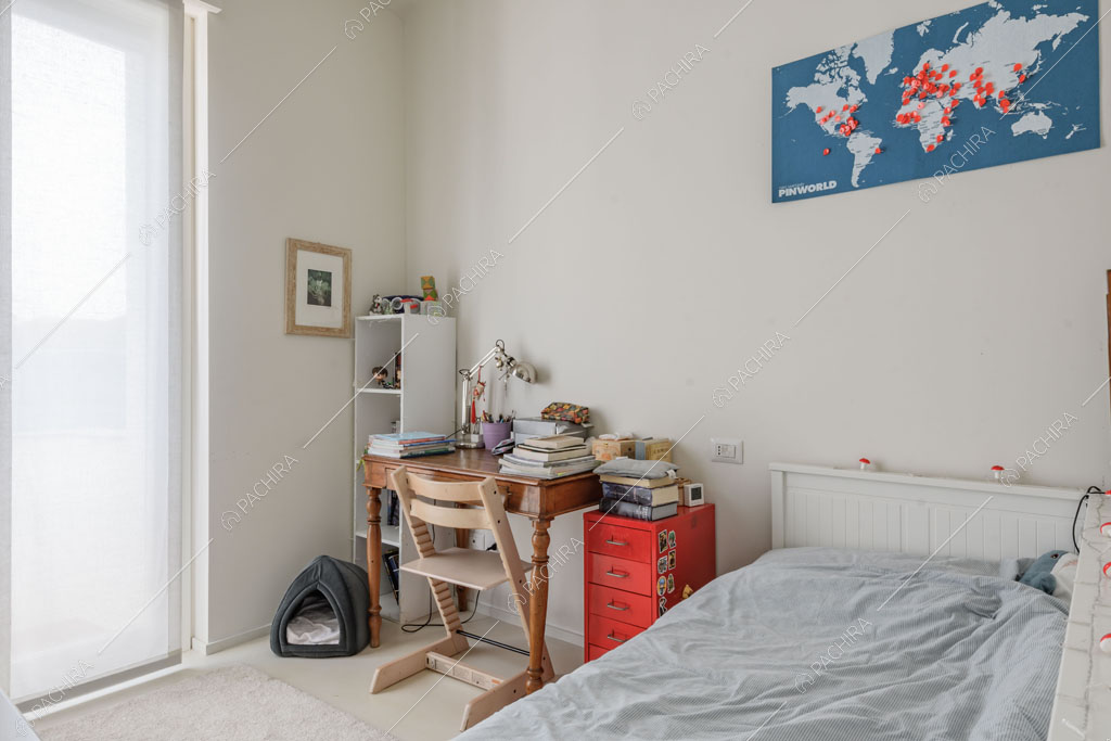 Camera da letto dell'appartamento Papagayo, location in stile contemporaneo a Milano