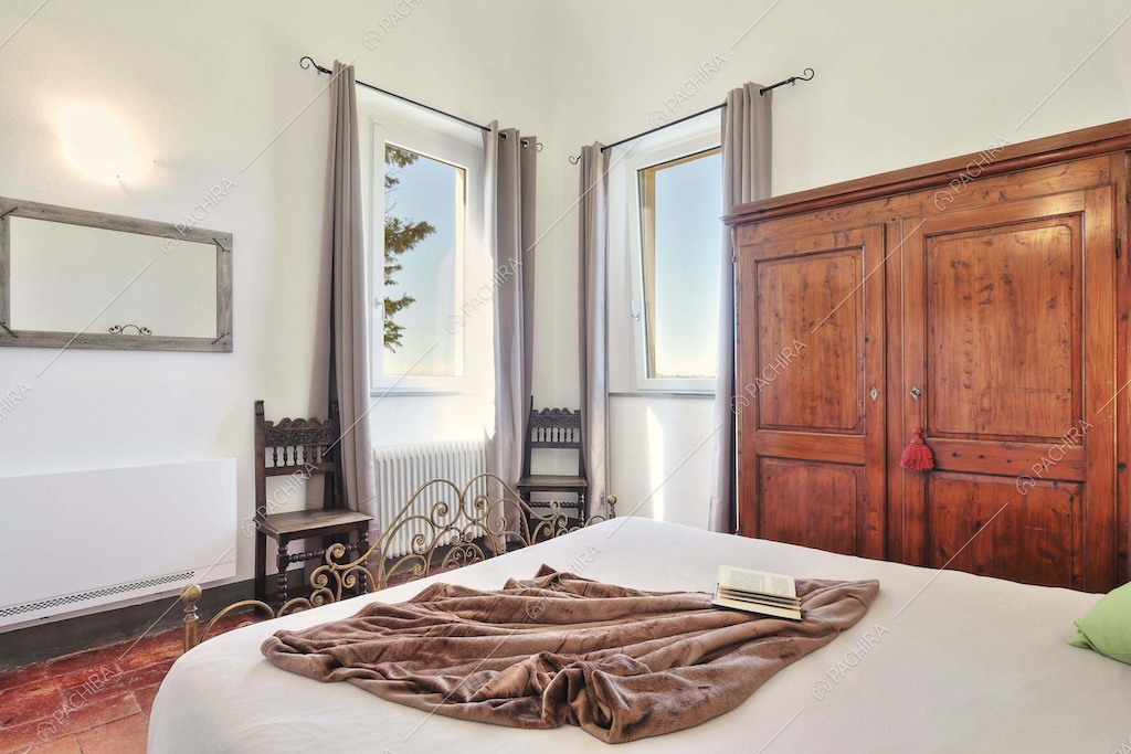 Camera da letto della dimora storica Denali, location in stile classico a Pisa