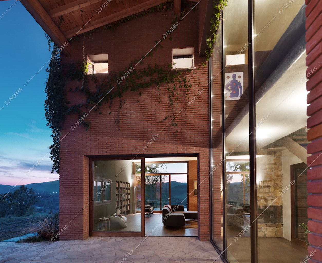 Esterni con vetrate e pareti in mattoncini di questa villa moderna in Provincia di Piacenza