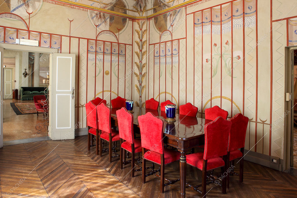 Sala da pranzo con pareti affrescate della dimora storica Seram, location in stile classico a Bologna