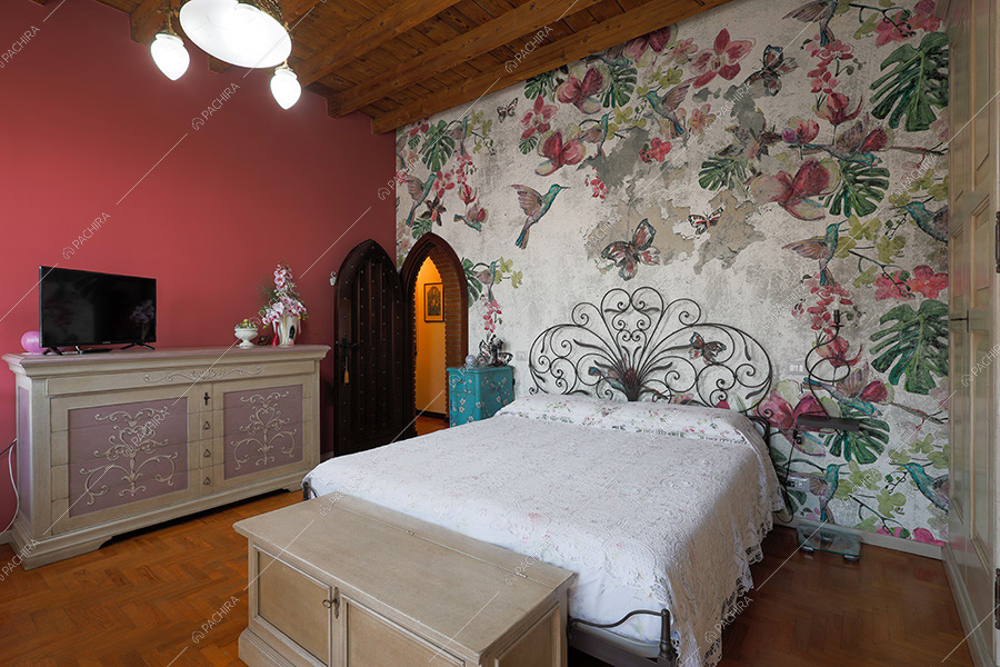 Camera da letto della cascina Spluga, location in stile rustico a Milano