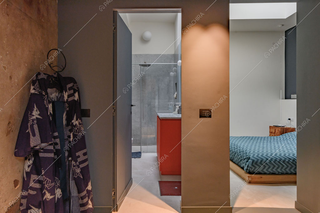 Camera da letto del loft Unakite, location in stile moderno a Milano