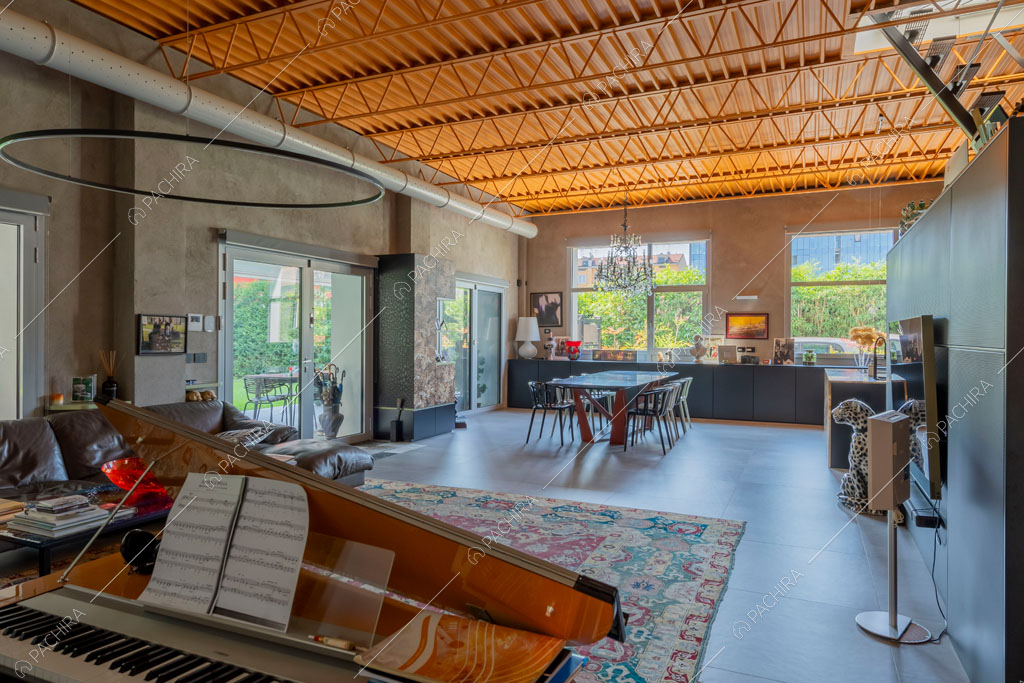 Zona living del loft Graviola, location in stile contemporaneo a Milano
