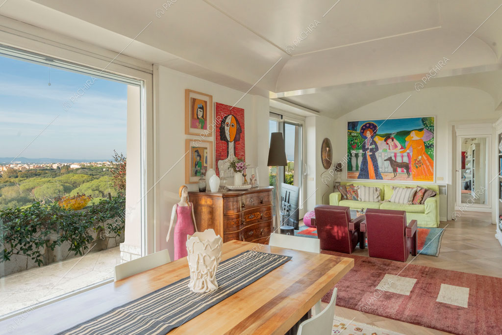 Zona living dell'attico Elbrus, location in stile contemporaneo a Roma