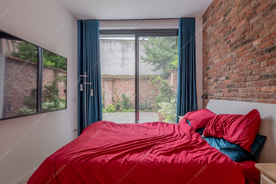 Camera da letto del loft Ob, location in stile moderno a Milano