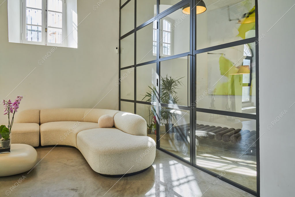 Zona living del loft Manaslu, location in stile minimal a Roma